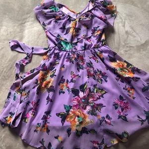 A light,flowy,floral dress, the brand is zunie